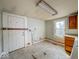 Unfinished kitchen shows a door to the outside and a window that lets in natural light at 1929 Wilcox St, Indianapolis, IN 46222