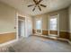 Living room featuring classic details, a ceiling fan, and abundant natural light at 1929 Wilcox St, Indianapolis, IN 46222