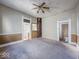Bright living room with ceiling fan and original details awaiting personal touches and updates at 1929 Wilcox St, Indianapolis, IN 46222
