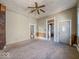 Spacious living room with a ceiling fan awaiting updates and personal touches at 1929 Wilcox St, Indianapolis, IN 46222