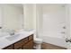 Bathroom featuring wood-look floors, vanity, toilet, and tub with tiled shower at 19511 Grassy Branch Rd, Westfield, IN 46074