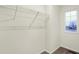 Walk-in closet with carpet and shelf in a well lit room with a window at 19511 Grassy Branch Rd, Westfield, IN 46074