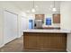 Elegant kitchen with a central island, stainless steel appliances, and ample counter space at 19511 Grassy Branch Rd, Westfield, IN 46074