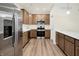 Modern kitchen featuring stainless steel appliances, light wood cabinets, and hardwood floors at 19511 Grassy Branch Rd, Westfield, IN 46074