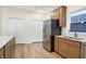 Bright kitchen area featuring white countertops, wood cabinets, stainless steel appliances, and a window at 19511 Grassy Branch Rd, Westfield, IN 46074