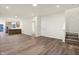 Open-concept living room flows into the kitchen, ideal for modern living at 19511 Grassy Branch Rd, Westfield, IN 46074