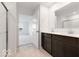 Bright bathroom with dual vanity, large mirror, and glass-enclosed shower at 2150 Aviary Ln, Danville, IN 46122