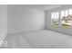 Bright bedroom with neutral carpet and double windows at 2150 Aviary Ln, Danville, IN 46122