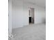 Bright bedroom showcasing neutral carpet, white walls and ensuite bathroom at 2150 Aviary Ln, Danville, IN 46122