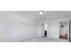 Bedroom with neutral carpet and open doors to an ensuite bathroom and walk-in closet at 2150 Aviary Ln, Danville, IN 46122