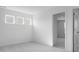A bedroom with three windows and neutral carpet, complemented by white walls at 2150 Aviary Ln, Danville, IN 46122