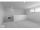 Spacious bonus room featuring neutral carpet, white walls, and natural lighting at 2150 Aviary Ln, Danville, IN 46122