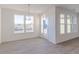 Bright dining area features large windows, wood-look floors, and modern lighting at 2150 Aviary Ln, Danville, IN 46122