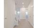 Bright entryway with luxury vinyl plank floors and convenient coat closet at 2150 Aviary Ln, Danville, IN 46122