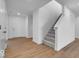 Light and bright entryway featuring a staircase with carpeted treads and LVT flooring at 2150 Aviary Ln, Danville, IN 46122
