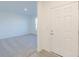Bright entryway with a white front door and view into carpeted living space at 2150 Aviary Ln, Danville, IN 46122