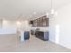 Open-concept kitchen with pendant lighting and stainless steel appliances at 2150 Aviary Ln, Danville, IN 46122