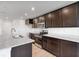 Modern kitchen featuring dark cabinets, stainless appliances, granite countertops, and an island at 2150 Aviary Ln, Danville, IN 46122