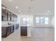 Stylish kitchen showcases dark gray cabinetry, granite counters, and a central island for entertaining at 2150 Aviary Ln, Danville, IN 46122