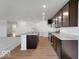 Kitchen featuring dark cabinets, stainless appliances, granite countertops, and an island at 2150 Aviary Ln, Danville, IN 46122