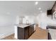 Open kitchen with an island, granite countertops and stainless steel appliances at 2150 Aviary Ln, Danville, IN 46122