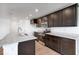 Kitchen featuring dark cabinets, granite countertops, stainless appliances, and an island at 2150 Aviary Ln, Danville, IN 46122