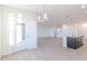 Open concept kitchen flowing into the living space, featuring modern appliances and an island at 2150 Aviary Ln, Danville, IN 46122