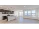 Modern kitchen featuring gray cabinets, granite countertops, and an island with pendant lighting at 2150 Aviary Ln, Danville, IN 46122
