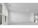 Spacious room with large windows, neutral carpet, and ample natural light at 2150 Aviary Ln, Danville, IN 46122