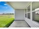 Covered patio features an outside view of lush green grass and clear blue skies at 2150 Aviary Ln, Danville, IN 46122