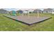 Community playground area with slides and swings for outdoor fun and recreation at 2150 Aviary Ln, Danville, IN 46122