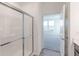 Bathroom with shower featuring sliding glass doors and view of bedroom at 2150 Aviary Ln, Danville, IN 46122