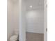 An empty walk-in closet featuring built-in storage and neutral carpeting at 2150 Aviary Ln, Danville, IN 46122