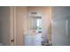 Bright bathroom featuring white cabinetry, countertop, and fixtures with a bedroom view through the mirror at 2349 S Copperstone Dr, New Palestine, IN 46163