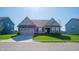 Charming single-story home with a well-manicured lawn and a two-car attached garage at 2349 S Copperstone Dr, New Palestine, IN 46163