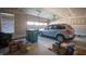 A two car garage with a silver SUV, featuring ample storage space and natural light from the windows at 2349 S Copperstone Dr, New Palestine, IN 46163