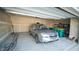 Spacious two car garage featuring a silver SUV, ample storage space, and finished walls at 2349 S Copperstone Dr, New Palestine, IN 46163
