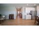 Bright hallway connects the home's living spaces, complemented by light-colored walls and wood-look floors at 2349 S Copperstone Dr, New Palestine, IN 46163