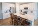Modern kitchen with stainless steel appliances, a central island, and ample cabinet space at 2349 S Copperstone Dr, New Palestine, IN 46163