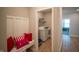 Mud room and laundry area featuring bench, storage hooks, washer and dryer at 2349 S Copperstone Dr, New Palestine, IN 46163