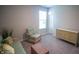 Sitting room area featuring sofa, chair, and accent chest with bright light from the window at 2349 S Copperstone Dr, New Palestine, IN 46163