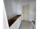 Bathroom area with newly installed cabinets and neutral door at 24409 Stout St, Sheridan, IN 46069