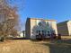 Backyard view of home with a wooden deck and spacious grassy lawn at 2549 Black Antler Ct, Indianapolis, IN 46217