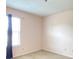 Bedroom features neutral carpet and paint, with a large window and blue curtain at 2549 Black Antler Ct, Indianapolis, IN 46217