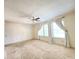 Carpeted bedroom with three large windows, ample natural light and neutral colored walls at 2549 Black Antler Ct, Indianapolis, IN 46217