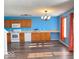 Updated kitchen with wood cabinets, laminate floor, white appliances, and lots of counter space at 2549 Black Antler Ct, Indianapolis, IN 46217