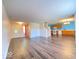 Open-concept living space with new laminate flooring connecting the living room and kitchen at 2549 Black Antler Ct, Indianapolis, IN 46217