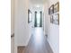 Hallway with dark wood floors and light walls, and a view into another room at 275 Hunters Ridge Dr, Danville, IN 46122