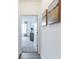 Hallway featuring modern artwork that leads into a carpeted bedroom at 275 Hunters Ridge Dr, Danville, IN 46122