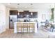 Stylish kitchen with modern appliances, white countertops, and bar seating at the center island at 275 Hunters Ridge Dr, Danville, IN 46122